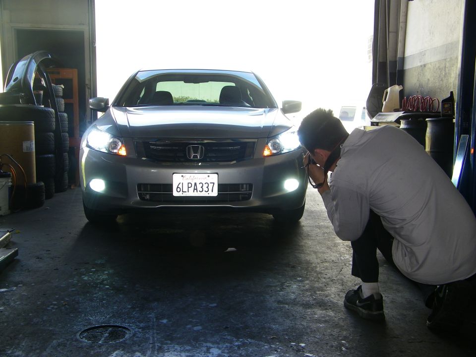 Silver sedan, 2008 Honda Accord, front view, with license plate 6LPA337, in a garage
