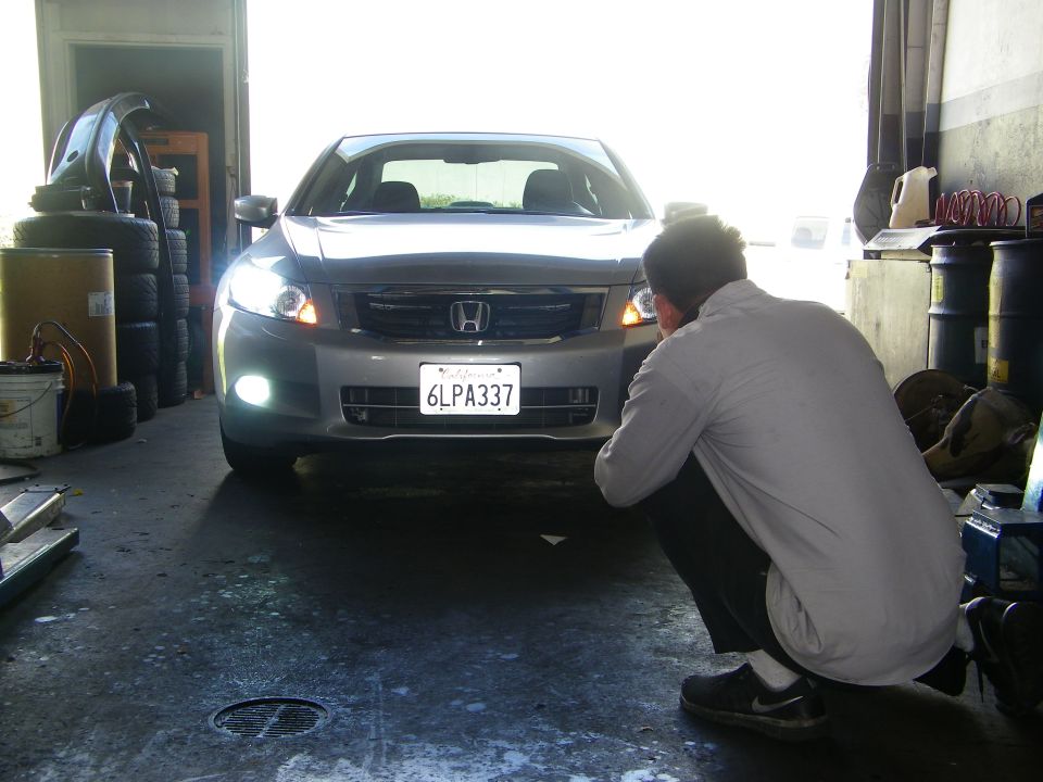 Front view of a silver sedan with HID headlights and a California license plate