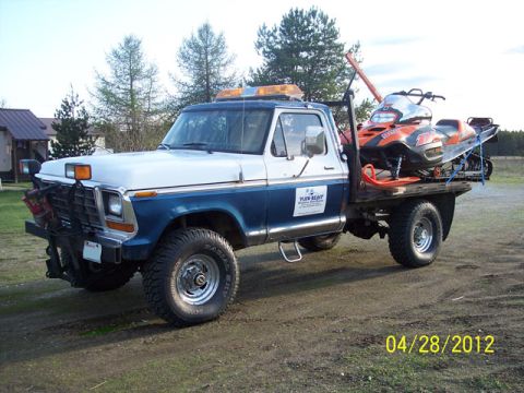 2004 Arctic Cat King Cat 900 - Ford F-Series flatbed truck transports a snowmobile. Date stamp shows 04/28/2012.