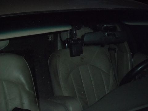 2000 Mercury Grand Marquis - The interior of a vehicle is visible, with a dashcam mounted near the rearview mirror.
