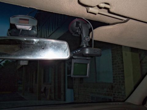 2000 Mercury Grand Marquis - Interior view of a dashcam and rearview mirror mounted to the windshield.