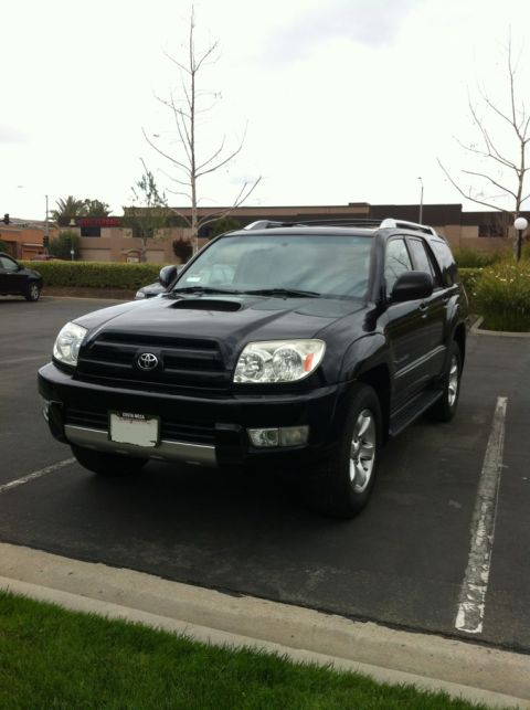 1990 Ford Probe - This black Toyota 4Runner is parked in a lot, showing its front 3/4 view.