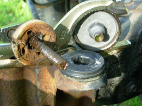 1983 Ford Bronco - Although the bolt & lower insulator look 100 years old, the upper insulator (on the frame perch) & shell (in the large-jaw Vise Grip 12L3 )…