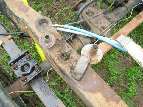 1983 Ford Bronco - The other body mounts are much simpler to remove. Simply back out the bolt until no threads are showing below the nut, then strike the bolt…