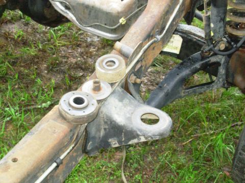 1983 Ford Bronco - The other body mounts are much simpler to remove. Simply back out the bolt until no threads are showing below the nut, then strike the bolt…