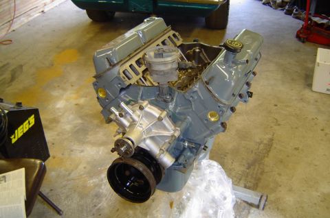 1993 Ford Bronco - Engine block with water pump and pulley, likely a V8. JEGS equipment is also visible.