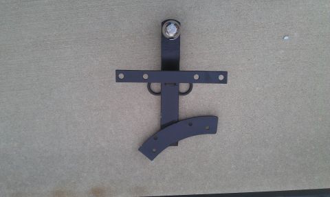 1991 Ford Festiva - A black metal trailer hitch component is shown against a concrete surface.