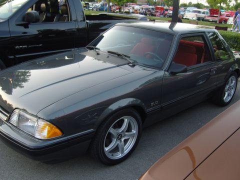 2007 Ford Mustang - A 1987 Ford Mustang GT with a 5.0 badge is parked at a car meet. The car has a red interior.