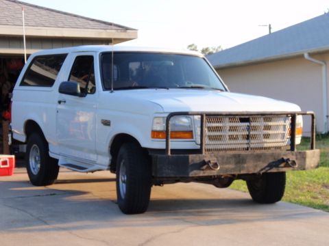 1995 Ford Bronco - Front view of a white 1995 Ford Bronco parked in a driveway.