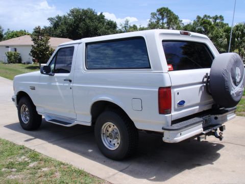 1995 Ford Bronco - This 1995 Ford Bronco is parked in front of a house on a sunny day.