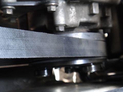 2003 Ford Taurus - Detail of an automotive AC clutch and belt system, showing mechanical components.