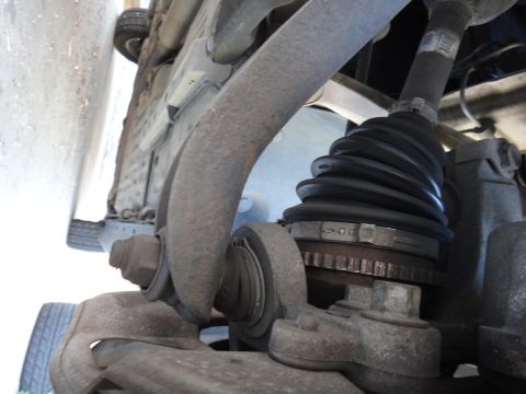 2003 Ford Taurus - Close-up view of the underside of a vehicle, focusing on suspension components.