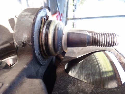 2003 Ford Taurus - Close-up view of a vehicle's ball joint, showing the threaded stud and its protective boot.
