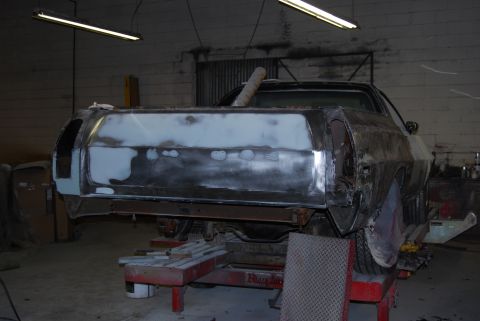 1975 Ford Ranchero - This vehicle is in a workshop, being prepped for paint with body filler visible on the rear panel.