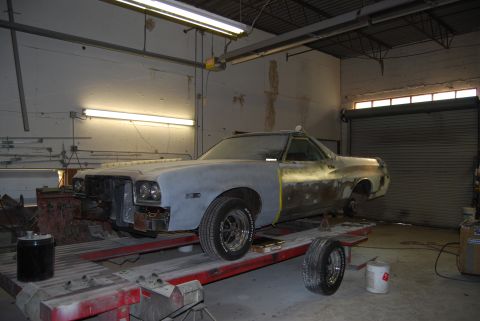 1975 Ford Ranchero - This 1975 Ford Ranchero is undergoing bodywork and is positioned on a lift in a workshop.