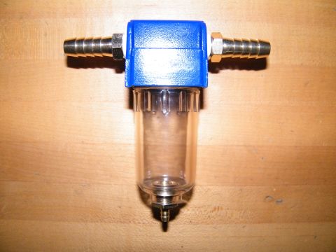 2004 Ford Crown Victoria - This is a fuel filter with a clear bowl and blue top, brass hose fittings.
