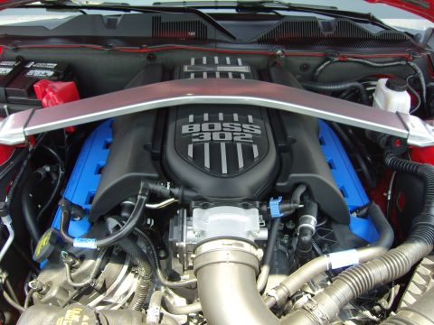 2007 Ford Mustang - Close-up of a Ford Mustang Boss 302 engine, showing the intake manifold and strut brace.