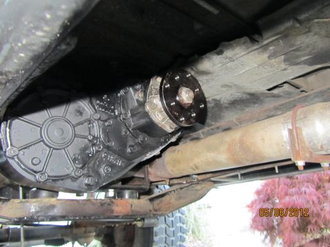 1984 Ford Bronco - Undercarriage view of a vehicle's transfer case and exhaust system, captured on May 6, 2012.