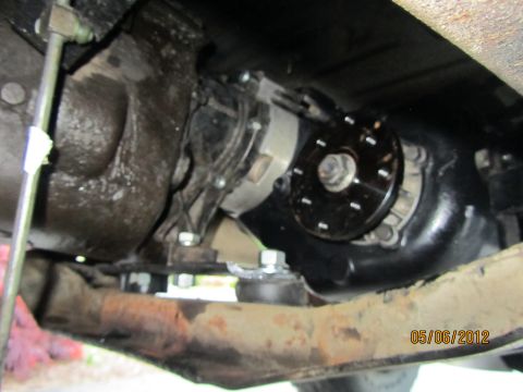 1984 Ford Bronco - Close-up of vehicle's transfer case and drivetrain components, with a date stamp.