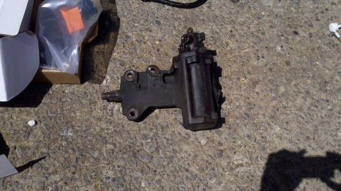 1978 Ford Bronco - A black steering gear box is shown on a concrete surface, with packaging in the background.