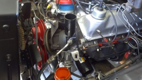 1978 Ford Bronco - Close-up view of an engine bay, showing various mechanical components and wiring.
