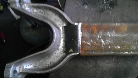 1987 Ford Ranger - A metal component, possibly a suspension part, shows evidence of welding and wear.