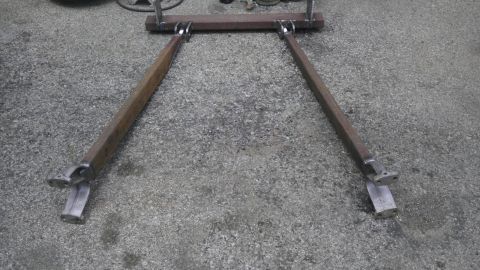 1987 Ford Ranger - Custom fabricated A-arm suspension component constructed from welded steel bars, resting on a concrete surface.