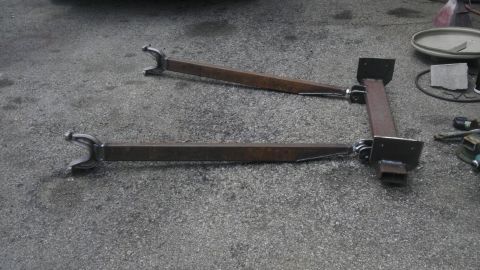 1987 Ford Ranger - Custom fabricated front suspension components are laid out on an asphalt surface.