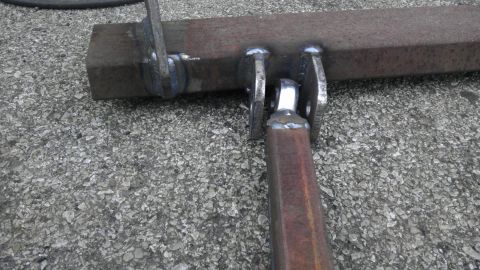 1987 Ford Ranger - Welded metal bracket assembly on a concrete surface.