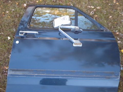 1990 Ford Bronco - This is a door from a 1990 Ford Bronco, likely removed for body work.