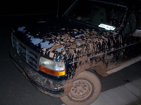 1992 Ford Bronco - This truck has clearly seen some off-road action, judging by the extensive mud splatter.