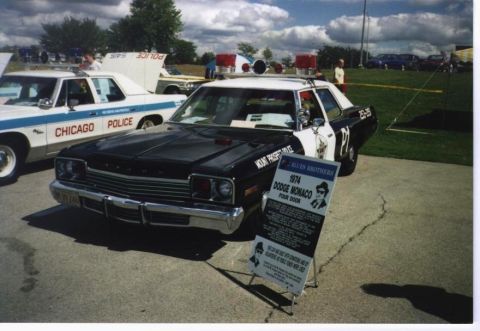1991 Ford LTD Crown Victoria - A 1974 Dodge Monaco police car is displayed next to a Chicago Police vehicle.
