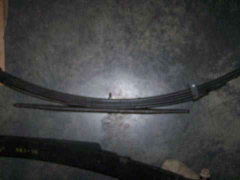 1992 Ford Bronco - Leaf springs are visible, with some yellow markings on one of the parts.