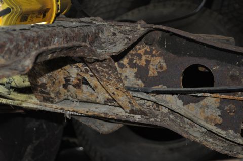 1986 Ford Bronco - The vehicle's frame shows significant rust and deterioration, indicating a need for repair or replacement.