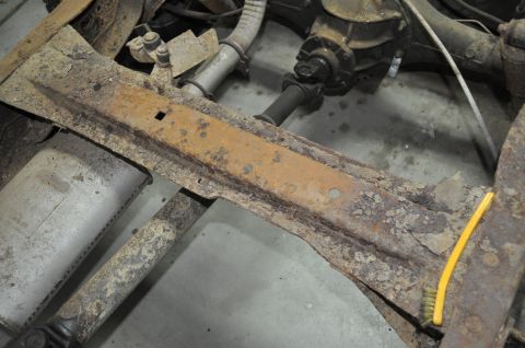 1986 Ford Bronco - The frame and undercarriage of a vehicle show significant rust and corrosion, indicating a need for repair or restoration.