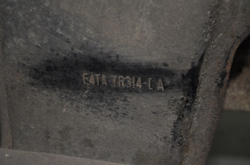 Cast metal part stamped with Ford part number F4TA 7R314-LA
