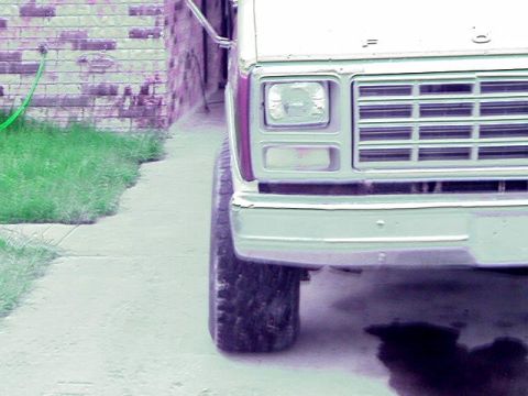 1980 Ford Bronco - Front view of a 1980 Ford Bronco showing its grille and headlight detail.
