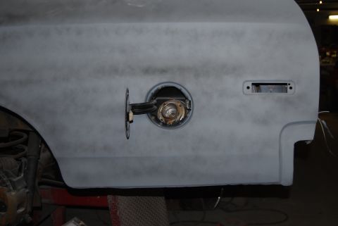 1975 Ford Ranchero - The vehicle's body is covered in primer, showing the fuel filler area and a rectangular cutout for a light.