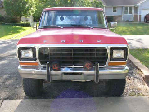 1979 Ford Bronco - Front view of a red 1979 Ford Bronco parked outdoors.