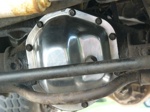 1979 Ford Bronco - Close-up view of a polished differential cover on the underside of a vehicle.