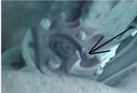 1990 Ford Bronco - Close-up of a suspension part, possibly showing wear or damage.