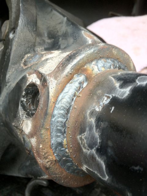 1995 Ford Bronco - Detail of a welded suspension part, likely part of an axle swap project.