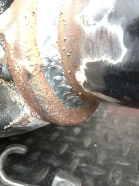 1995 Ford Bronco - Detail of a welded metal joint, likely part of an exhaust or suspension system.