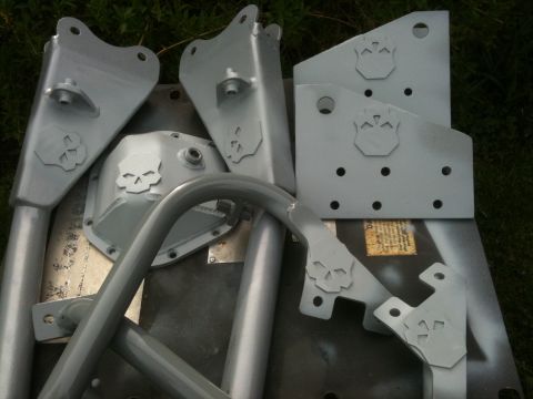 1995 Ford Bronco - Custom suspension components and roll cage tubing, all painted gray and skull cutouts.