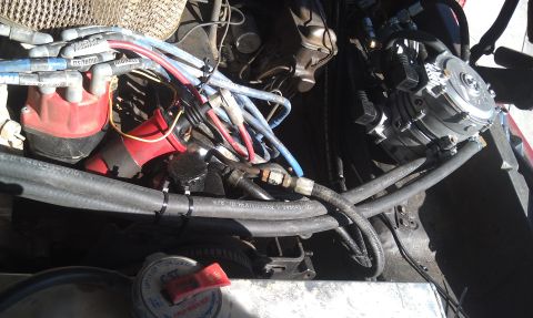 1978 Ford Bronco - Engine bay components including a propane conversion system are visible in this close-up view.