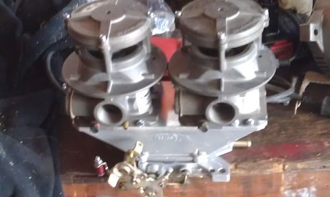 1978 Ford Bronco - Dual Edelbrock carburetors mounted on an intake manifold, likely for an engine build.
