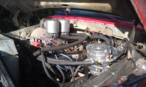 1978 Ford Bronco - The engine bay shows a propane conversion kit fitted alongside the original carburetor setup.