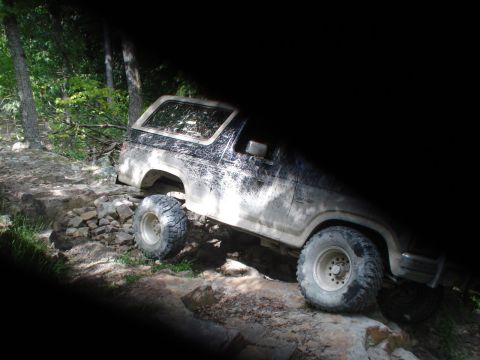 1992 Ford Bronco - This Ford Bronco navigates a challenging rocky off-road path.