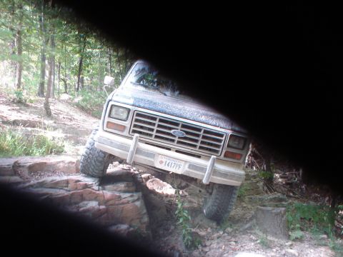 1992 Ford Bronco - This Ford Bronco navigates a challenging rocky trail, its off-road capabilities.