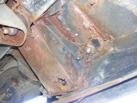1978 Ford Bronco - Severe rust damage is visible on the vehicle's frame and undercarriage components.